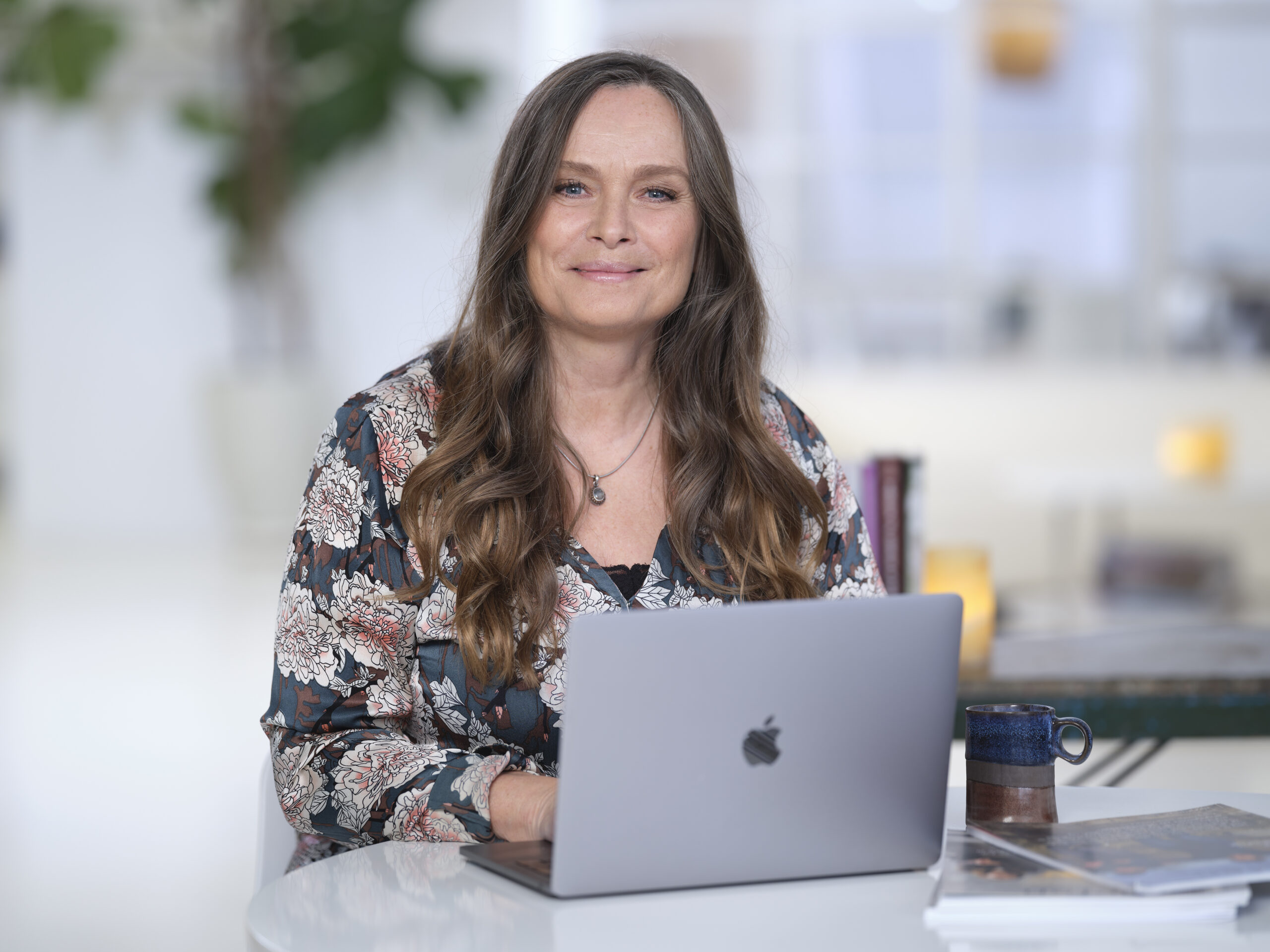 Woman sitting infront of her laptop